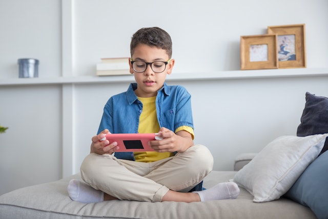 boy playing on his Nintendo Switch