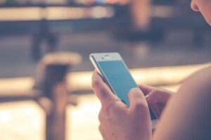 bystander using her smartphone